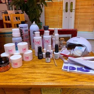 7 jars colored powder, finishing gel, primer, several size nail brushes and more